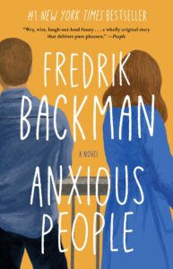 Cover for Anxious People by Fredrik Backman. It shows an illustration of a man and a woman wearing blue with their backs to the readers, up against and dark orange background.