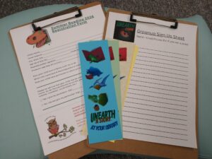 Photo of two sign up sheets on clipboards.